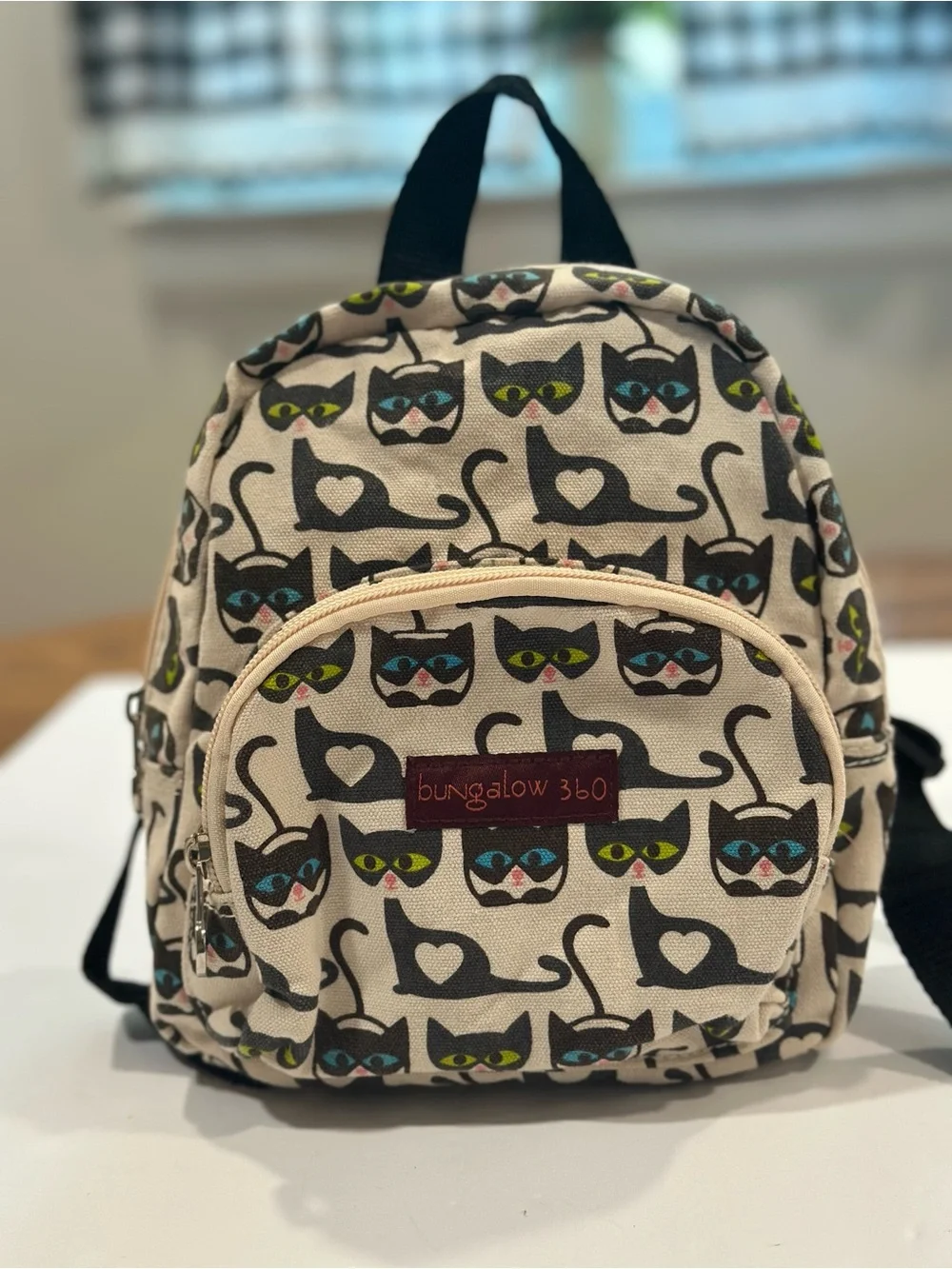 bungalow 360 Cream Mini Backpack with Black Cat Print and Colorful Eyes